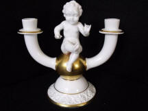 4380 Candle holder with cherub sitting on ball