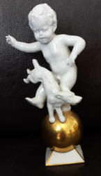 #5185 cherub and dog atop gold ball