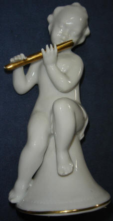 5428/B- Putti sitting on bell shaped base playing flute