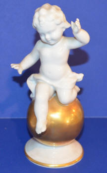 Cherub Sitting on Gold Ball