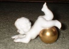 Gerold Porzellan Cherub Rolling on Gold Ball